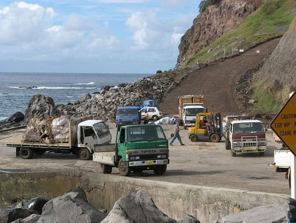 Trucks on wharf, Norfolk Island. Picture courtesy of Barry and Heather Minton