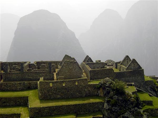 Another view of Machu Picchu amongst the mist in the mountains of Peru.